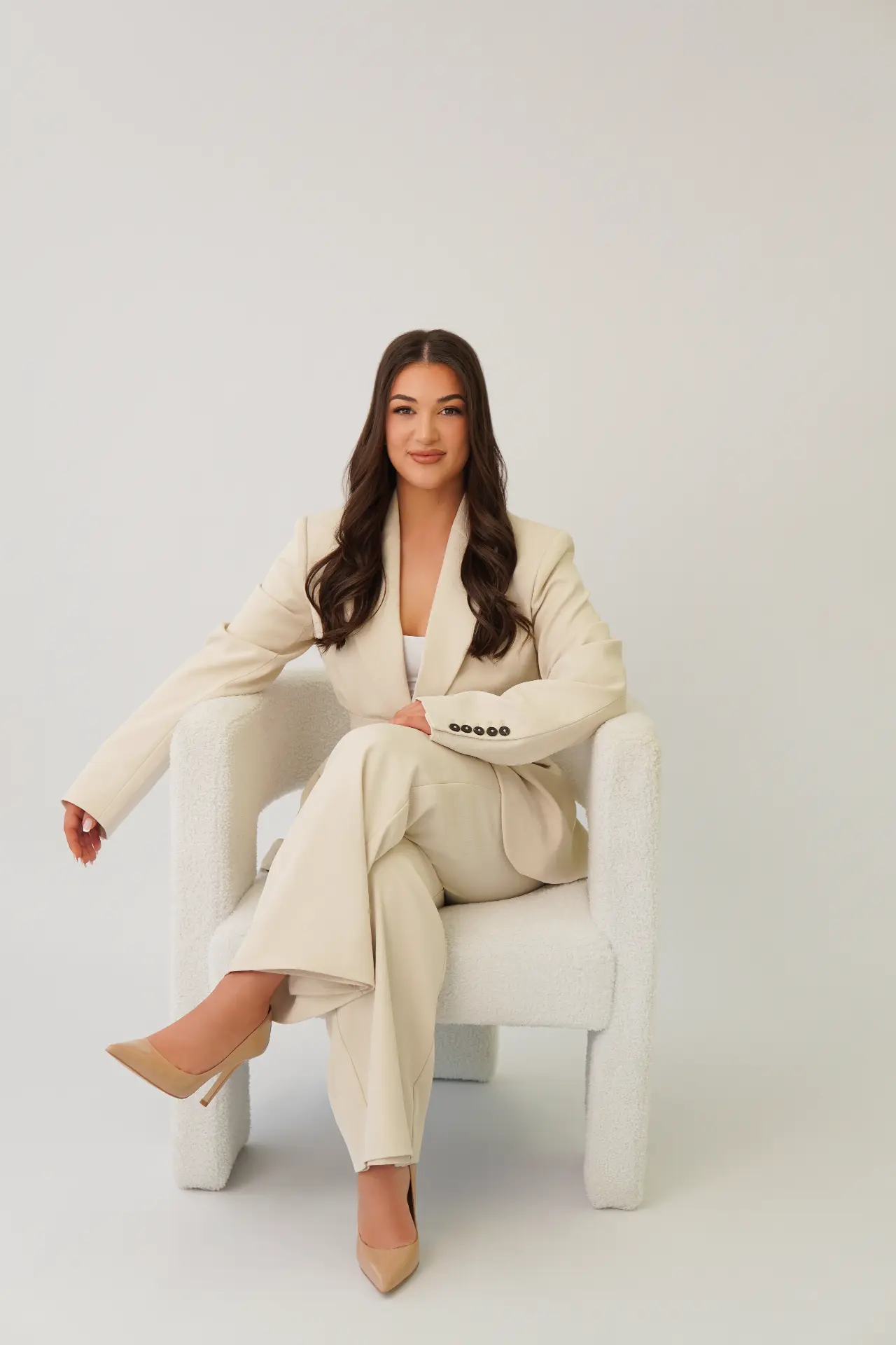 Confident founder portrait seated in studio