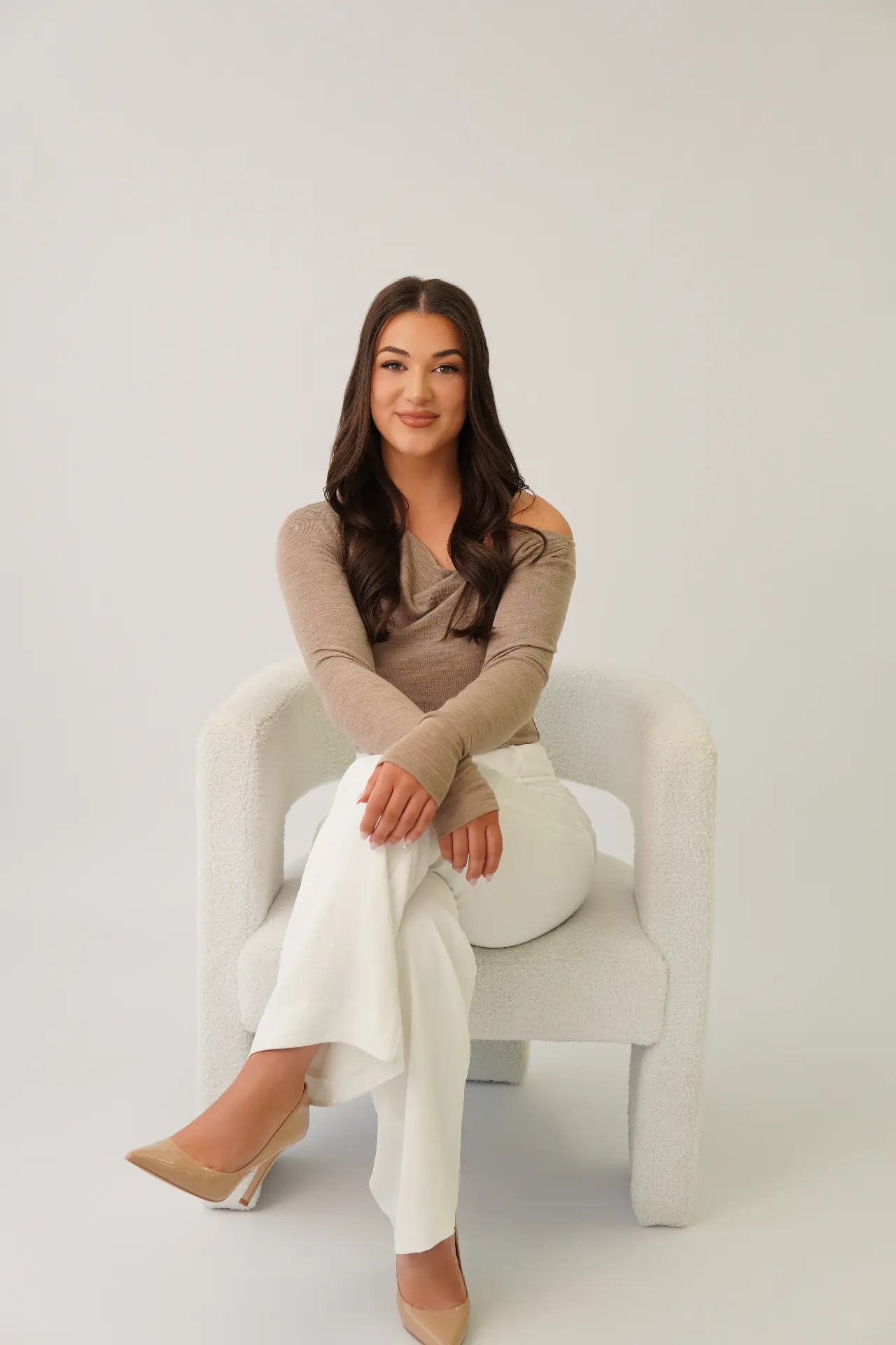 Retouched studio portrait in neutral knit