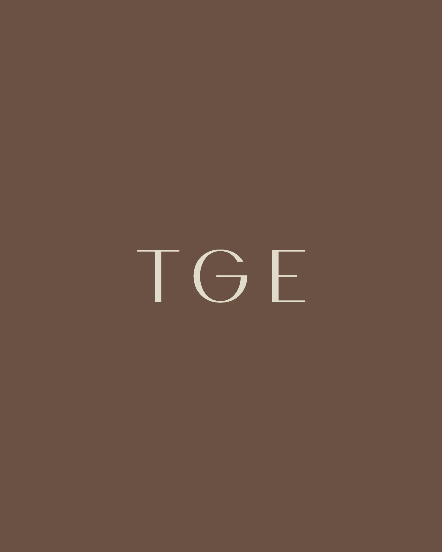 The Gestalt Edit TGE submark in cream on truffle