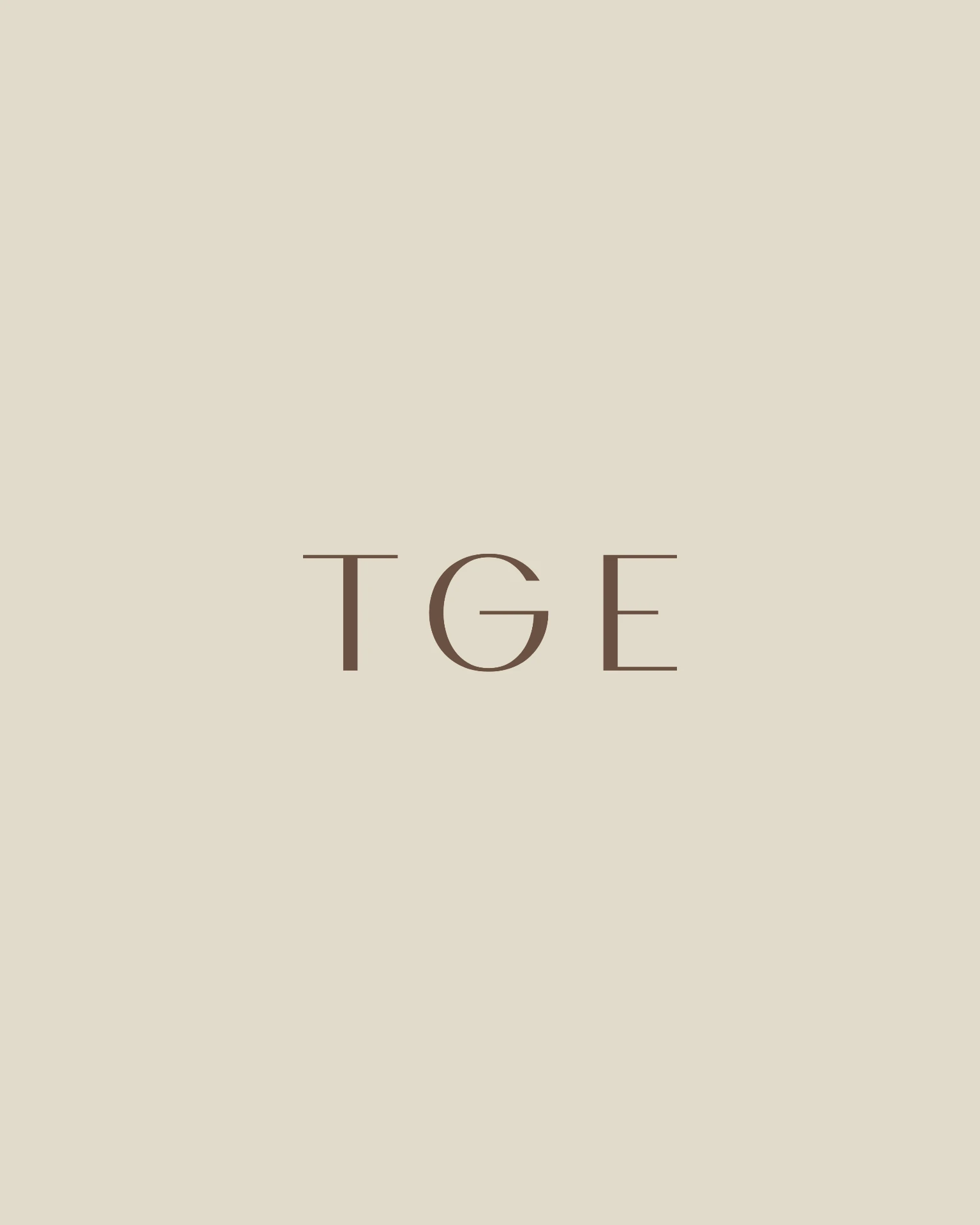 The Gestalt Edit TGE submark in truffle on cream